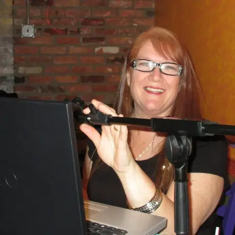 DJ Betty working at her DJ setup